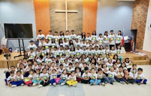 New Hope to Asia students gathered at the church