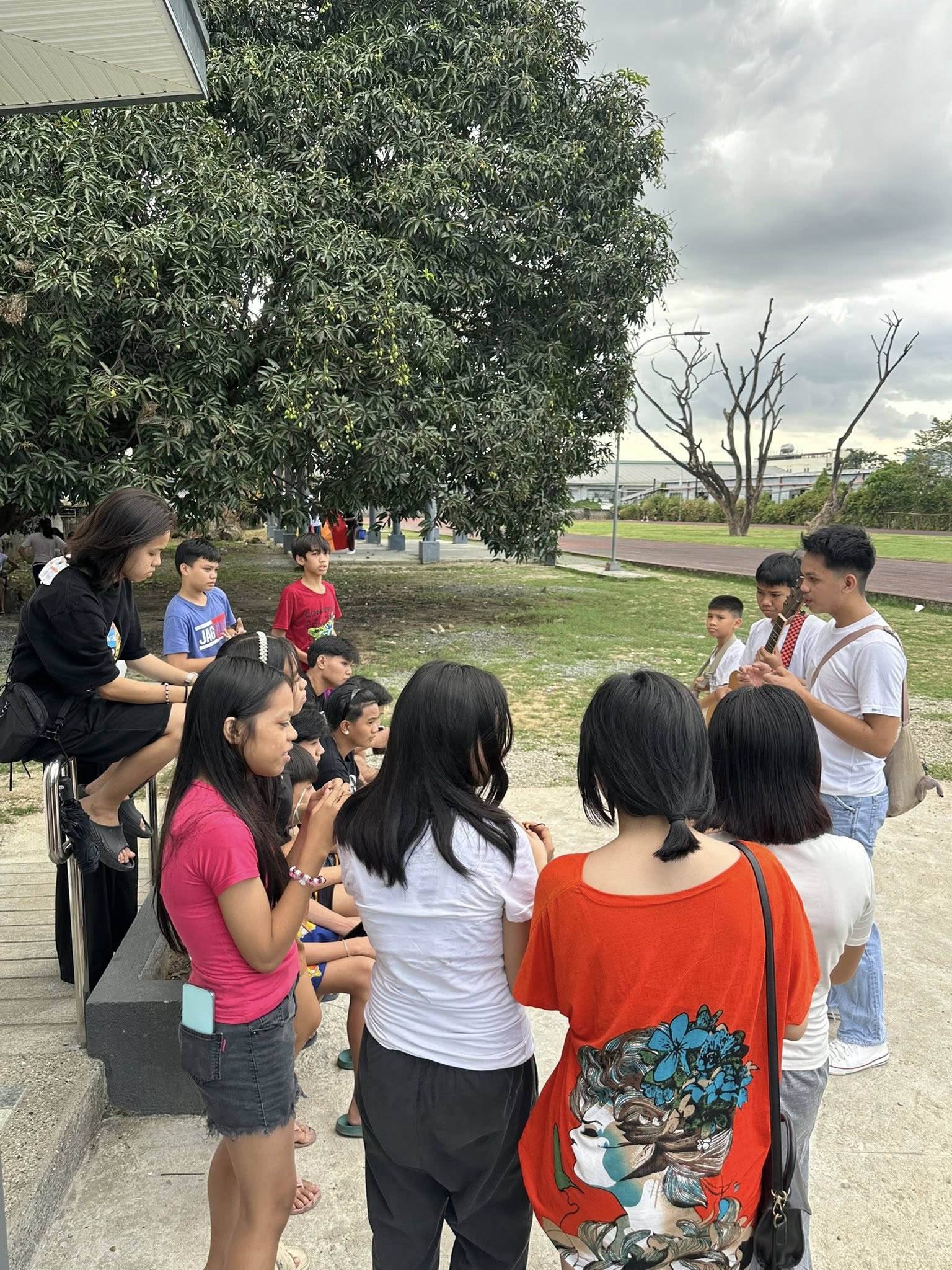 Youth group worshipping together at the park