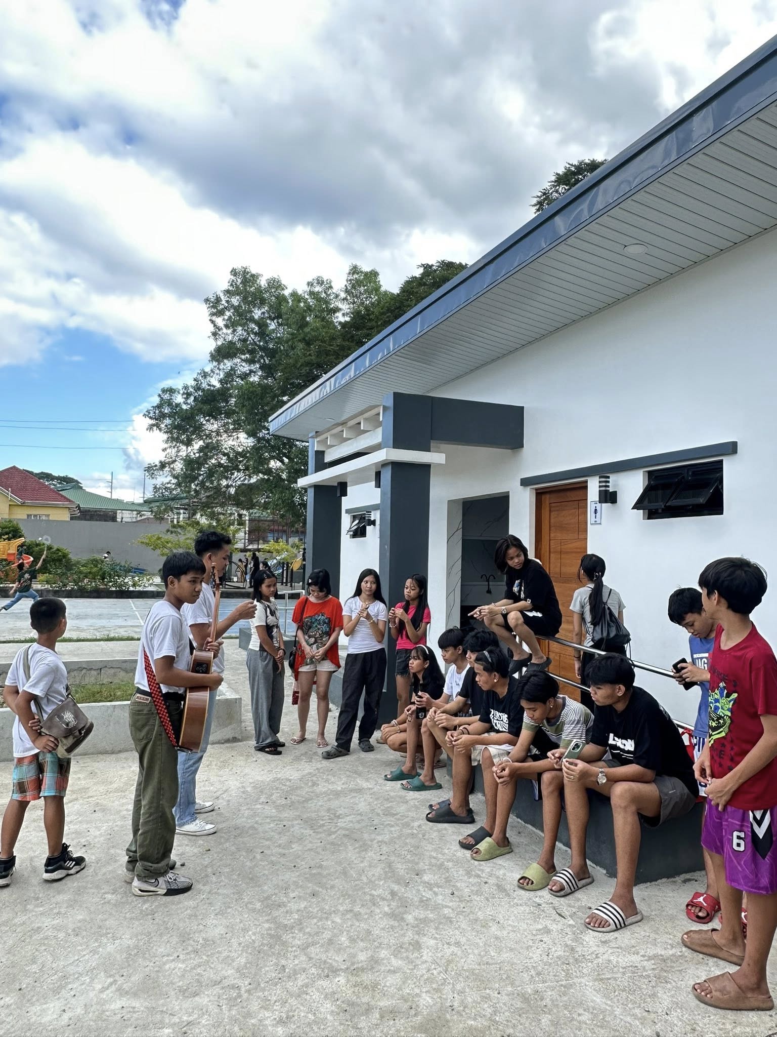 Youth sharing the gospel with people at the park