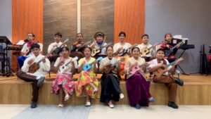 NHTA Christian School Grade 6 students in Filipiniana attire performing Tribes with colorful ukuleles during Thank You Sunday 2026