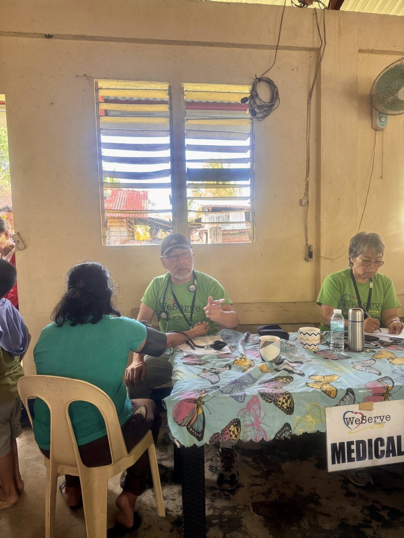 WeServe volunteer conducts a medical consultation with a patient in Masbate Province
